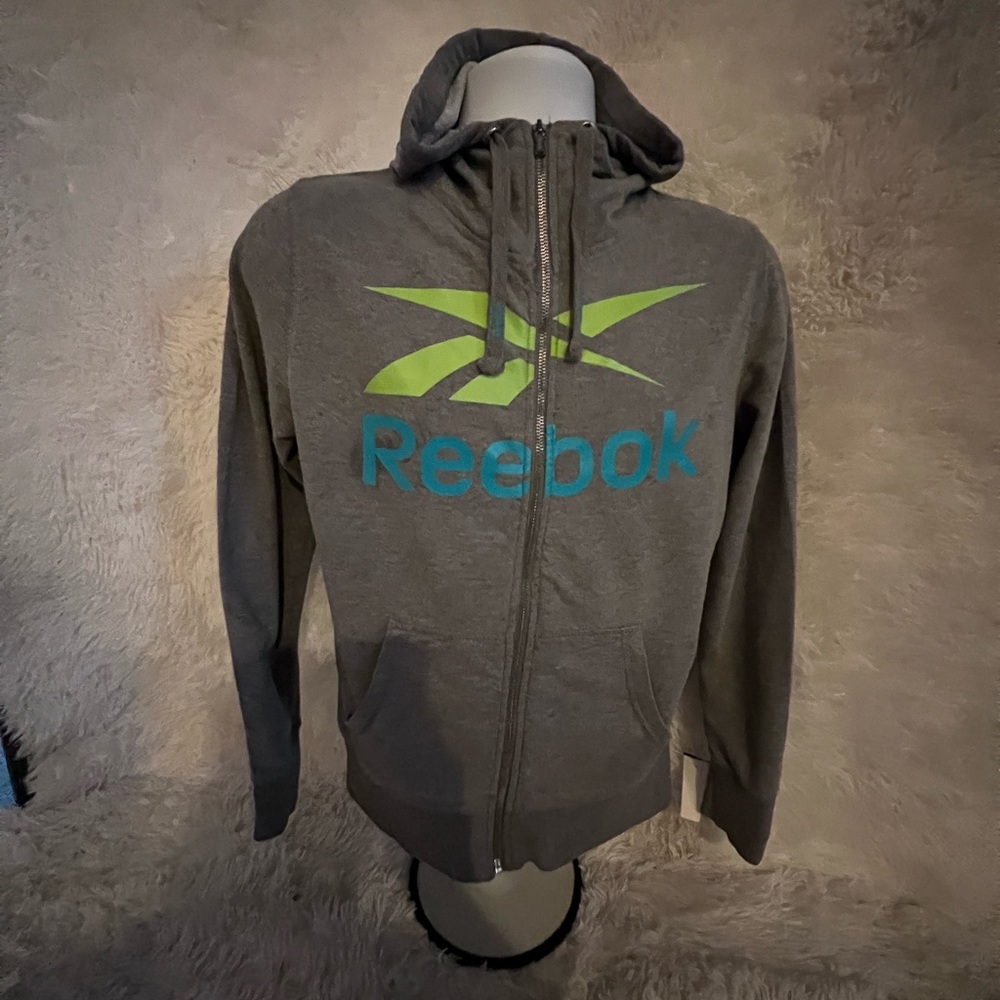 Reebok Sweater, pit to pit 1 ft and 18 and a half inch Length 2 ft